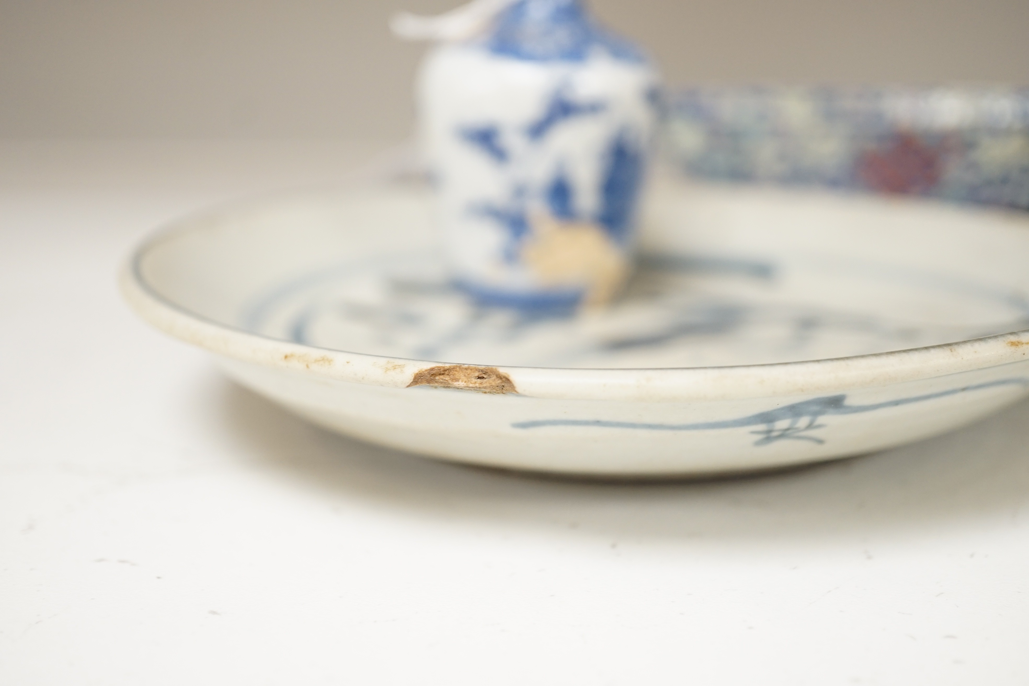 A Chinese enamelled porcelain cup stand, 15.2 cm, two Chinese blue and white plates and a small Japanese bottle vase